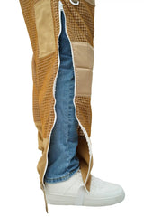 Full-length side zipper of khaki 3-layer mesh beekeeping trousers open revealing clothing underneath
