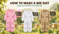 Pink, white and khaki Mellifera bee suits with detached veils hanging on a clothesline to air dry after washing