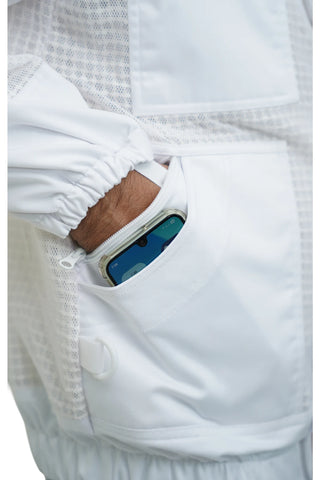 Close-up of the side zip pocket holding a smartphone on the 3 layer ventilated mesh beekeeping jacket and trouser set