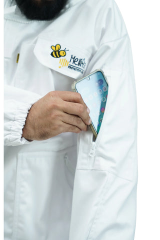 Close-up of zippered chest pocket on white beekeeping jacket with smartphone 