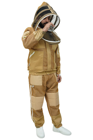  beekeeper in khaki mesh beekeeping jacket and trousers drinking water with fencing veil open