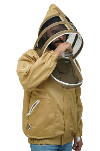 Beekeeper drinking water through the fencing veil of the khaki poly cotton beekeeping jacket