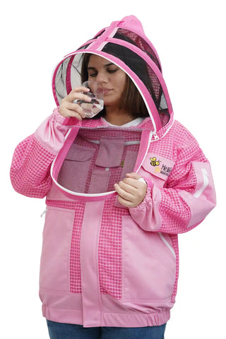 Beekeeper drinking water through the round veil of the pink 3 layer ventilated mesh beekeeping jacket