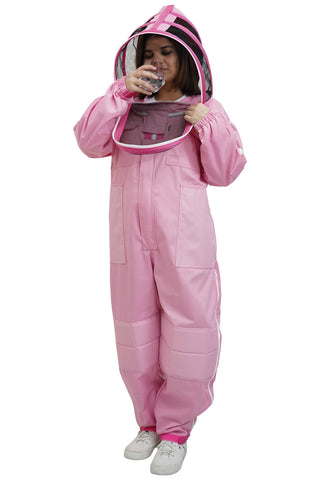Beekeeper drinking water through the round veil of the pink poly cotton beekeeping suit