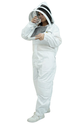 Beekeeper drinking water through the round veil of the poly cotton semi ventilated beekeeping suit
